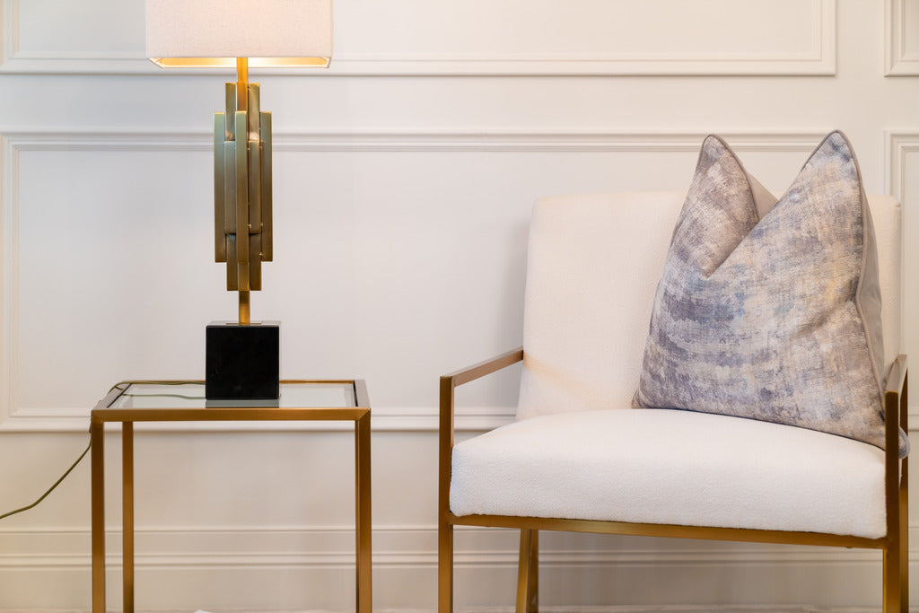 Gold lighting, gold furniture, gold tables, chair, pink lampshade