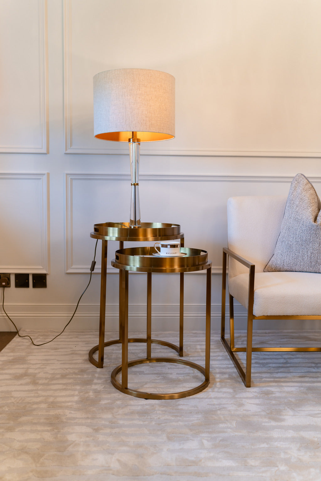 Gold mirrored tale, side tables, blush lampshade
