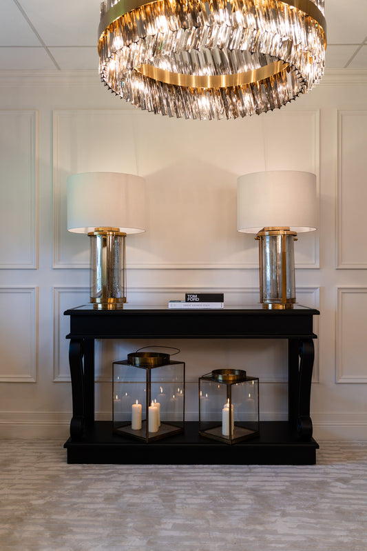 black furniture, black console table, indoor furniture, large lamps, lighting, gold lamps